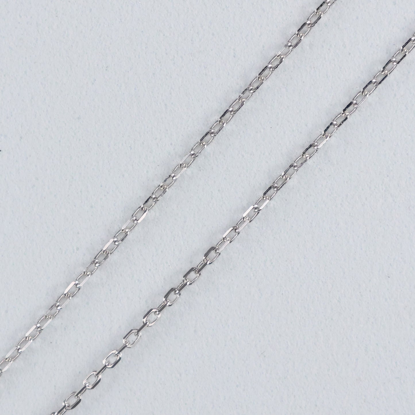 Close-up of silver chain for the Eternal Trinity Necklace with Cubic Zirconia highlighting its elegant design