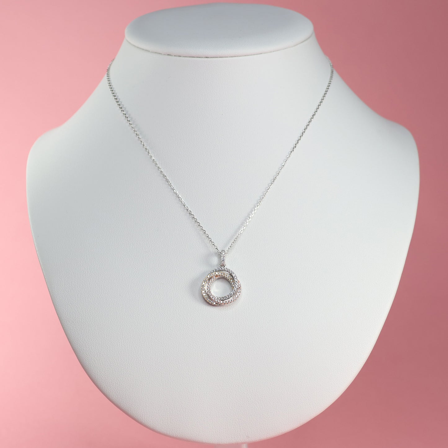 Elegant Eternal Trinity Necklace with Cubic Zirconia showcased on a white display bust