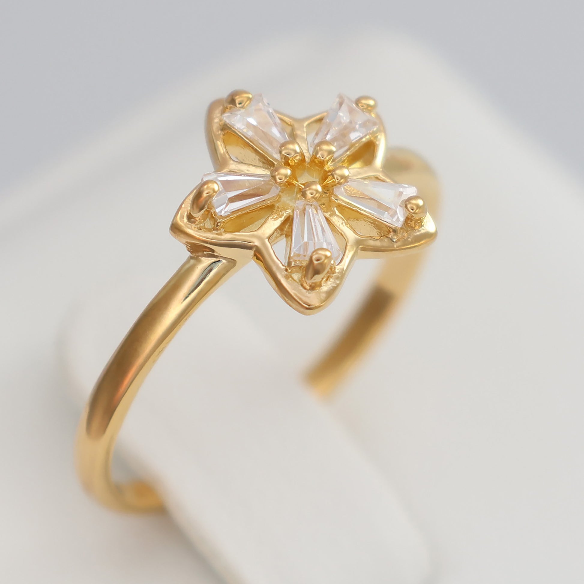 Flower design gold plated ring with sparkling accents for elegant jewelry lovers