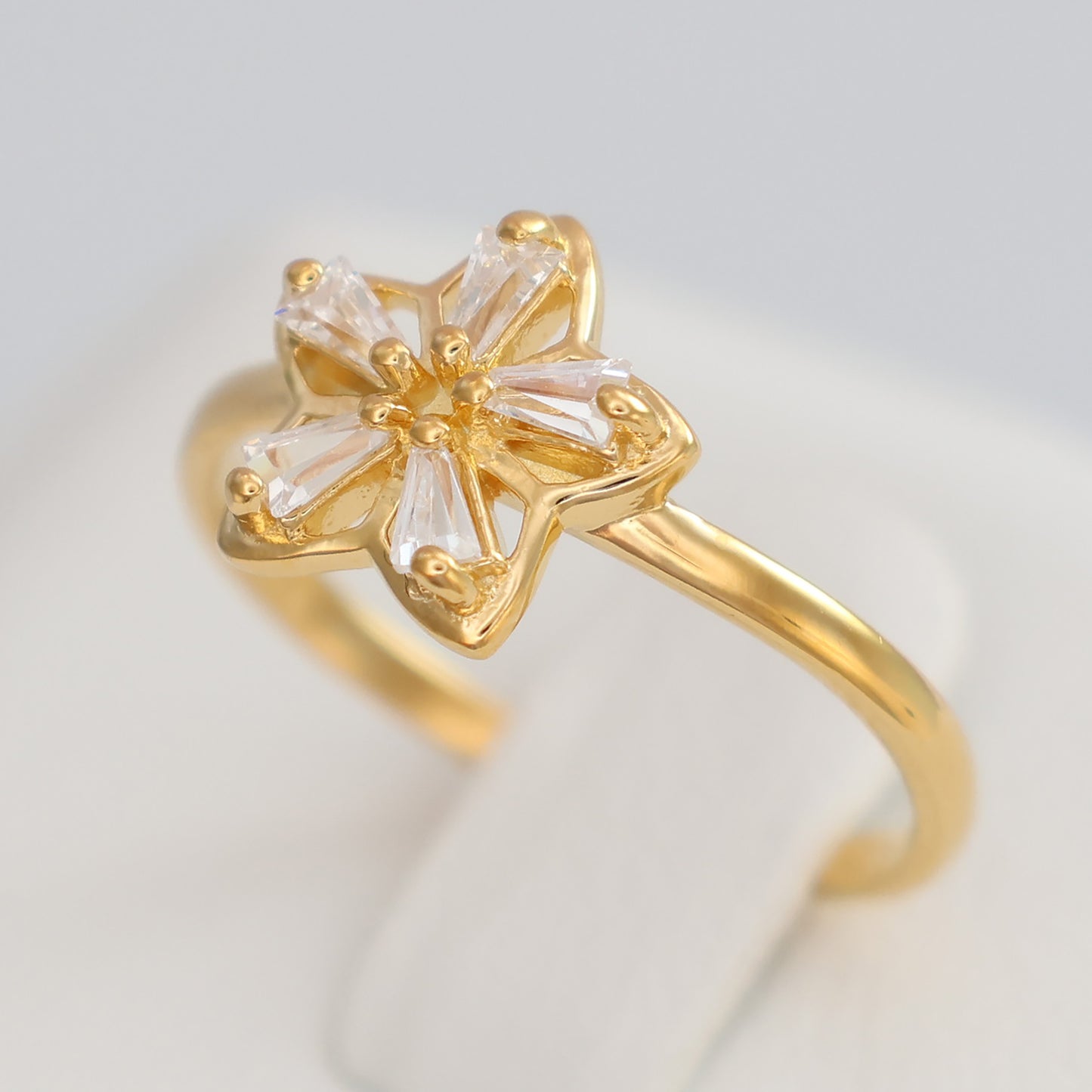 Elegant flower design gold plated ring featuring sparkling gemstones for a chic look