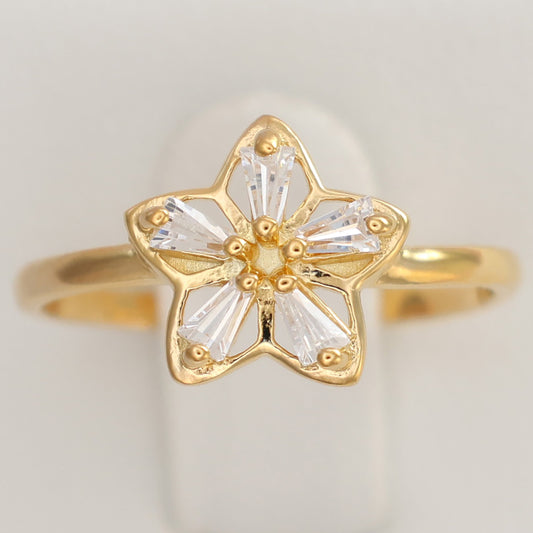 Flower design gold plated ring featuring a delicate star shape with sparkling stones