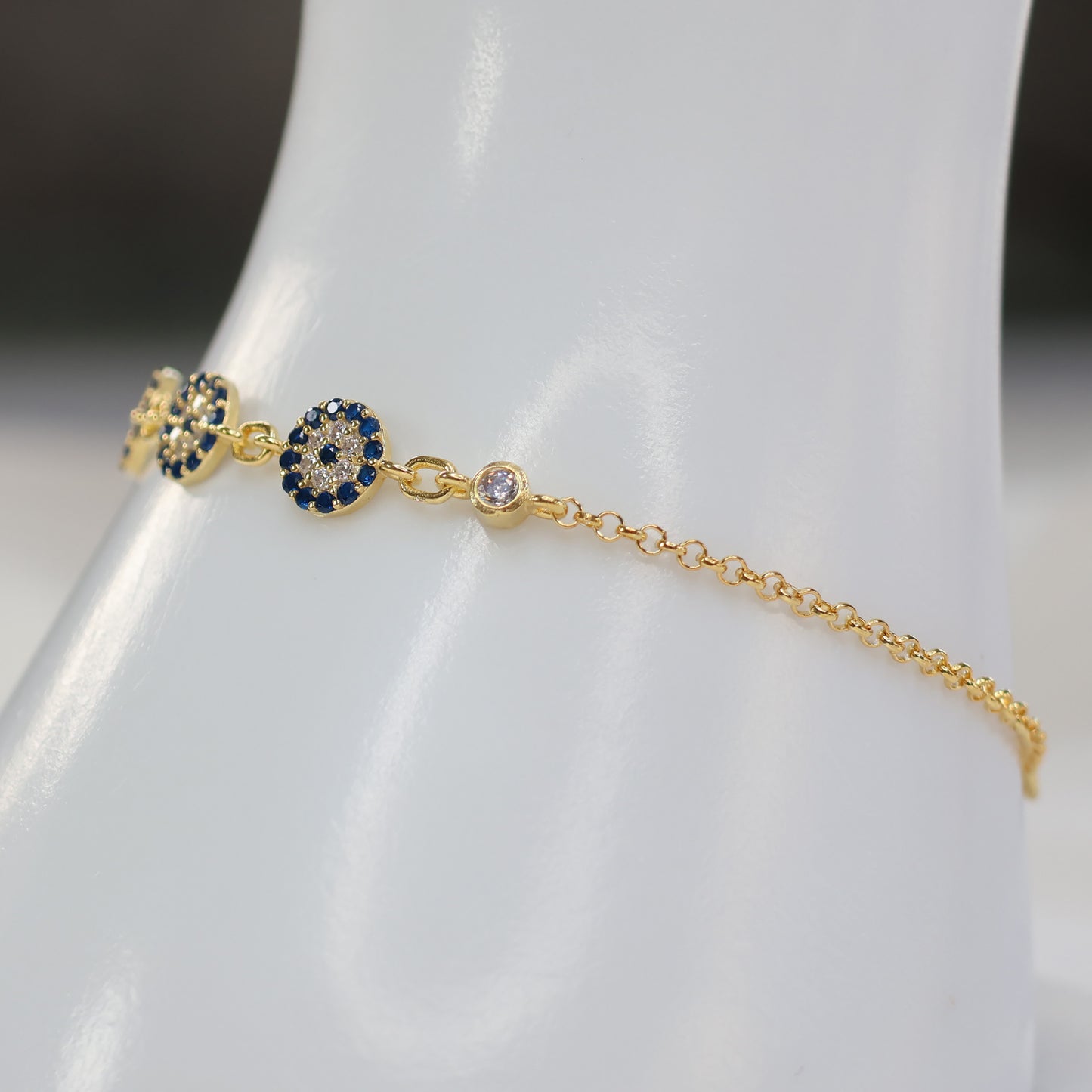 Delicate gold plated evil eye bracelet with navy blue stones and sparkling accent diamonds