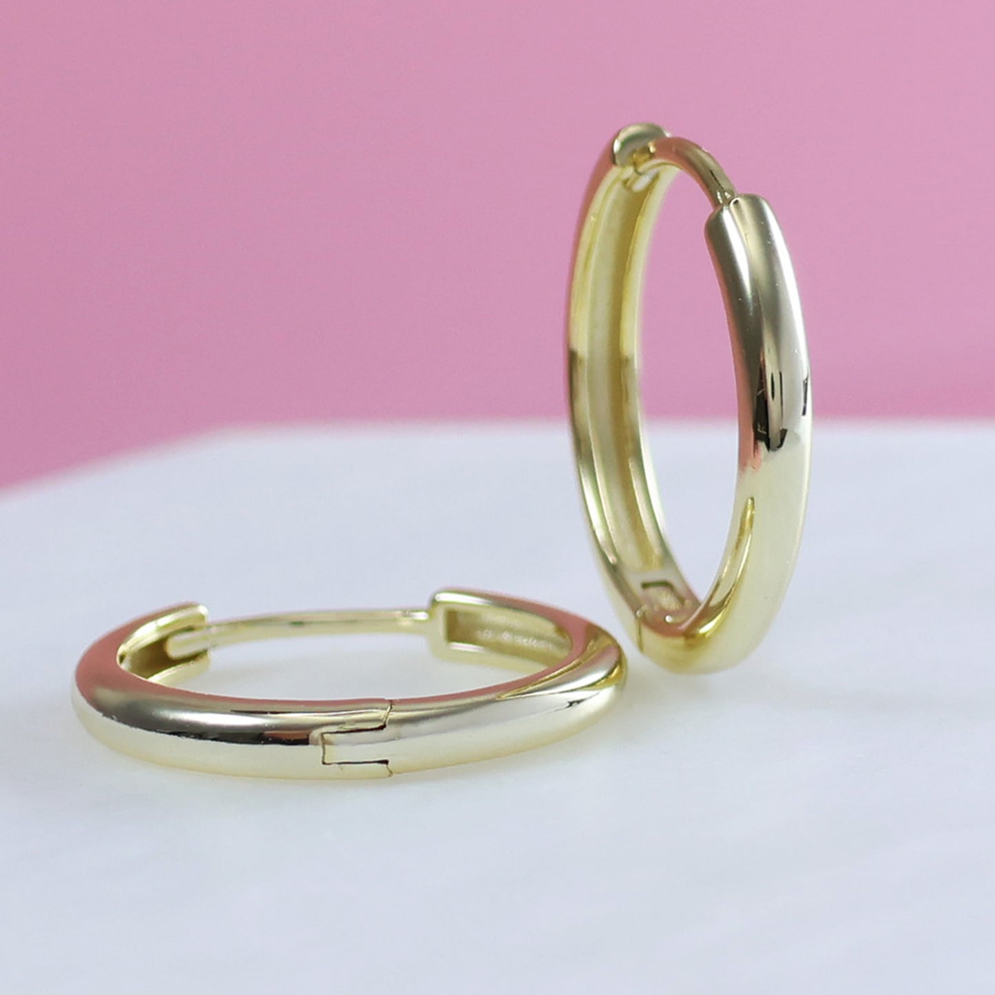 Stylish gold plated hoop earrings featuring a sleek and minimalist design