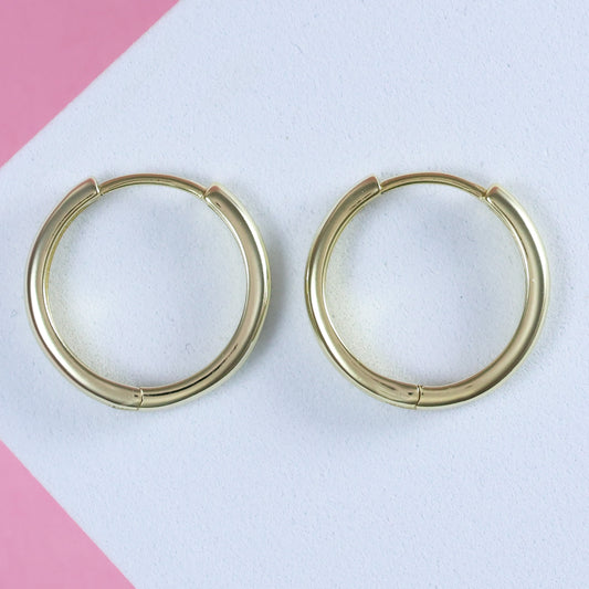 Gold plated hoop earrings with a sleek design and polished finish for everyday wear