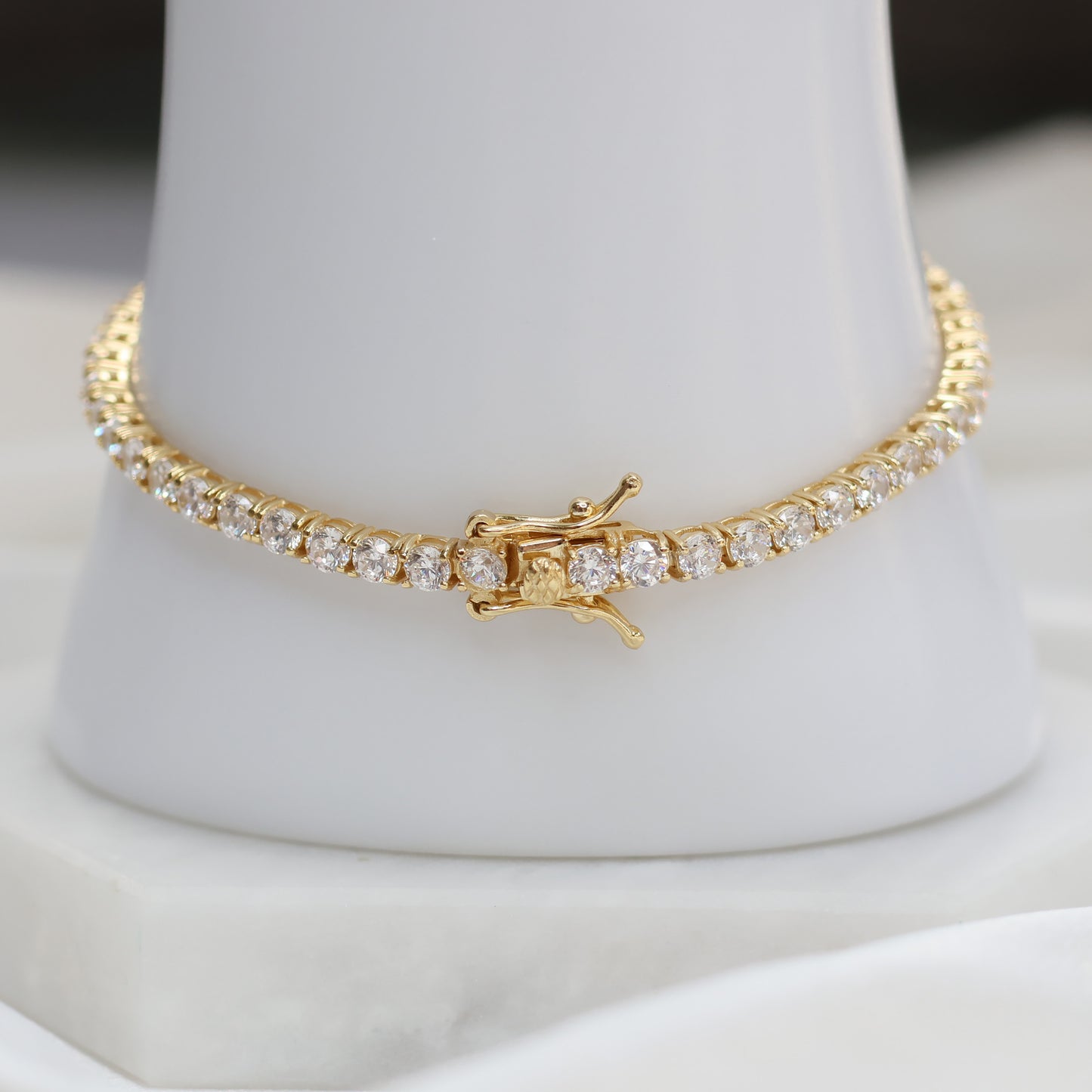 Elegant gold plated tennis bracelet adorned with sparkling cubic zirconia stones