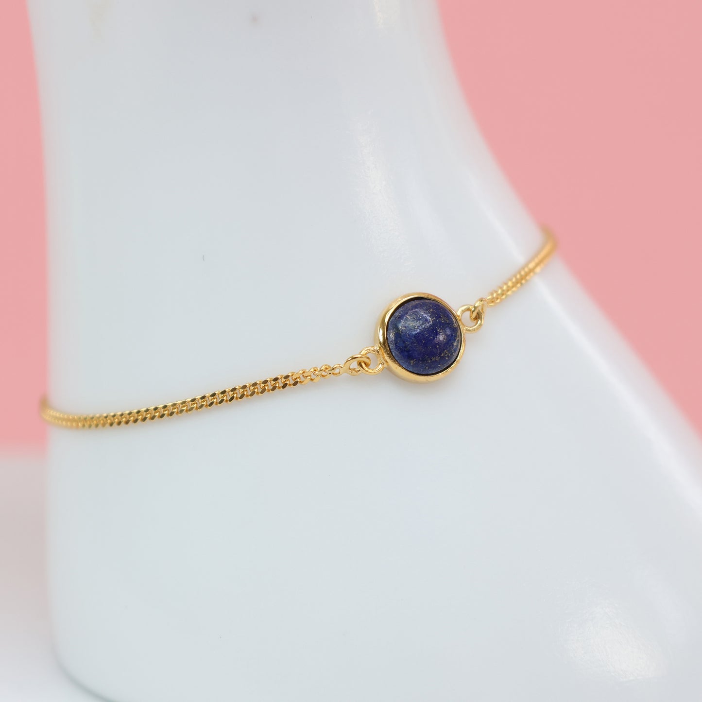 Elegant lapis stone bracelet with gold chain for a stylish and chic look
