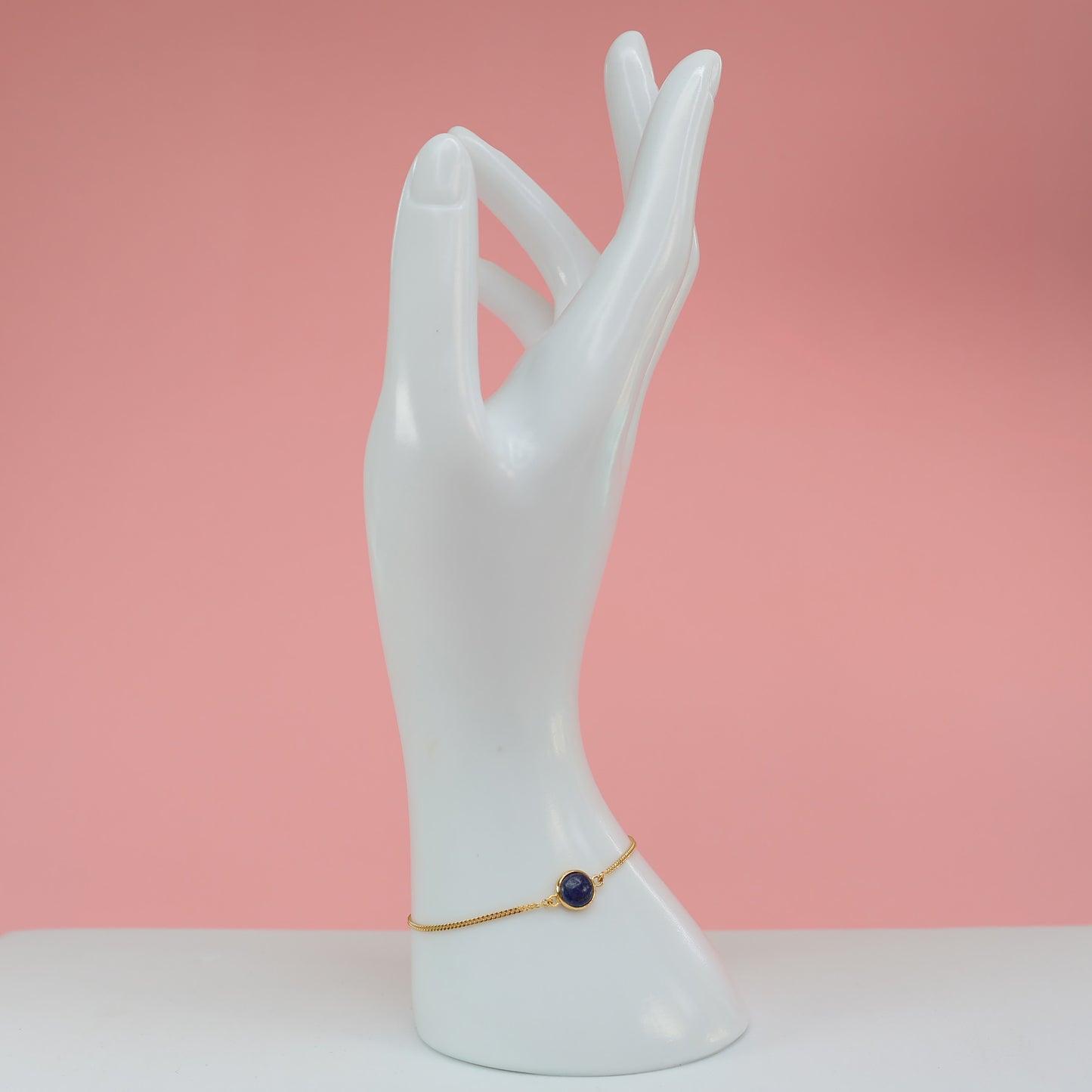 Elegant lapis stone bracelet on a white hand display for stylish accessories