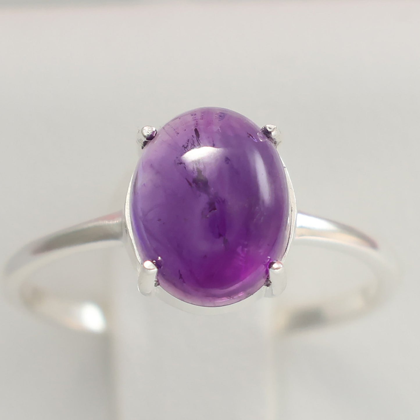 Large amethyst silver ring with an oval stone set in a sleek silver band for elegance