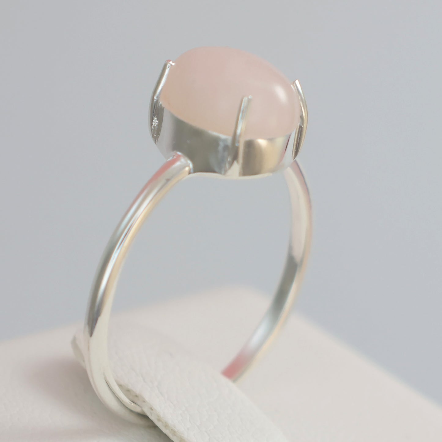 Elegant large rose quartz silver ring featuring a smooth gemstone setting for a stunning accessory