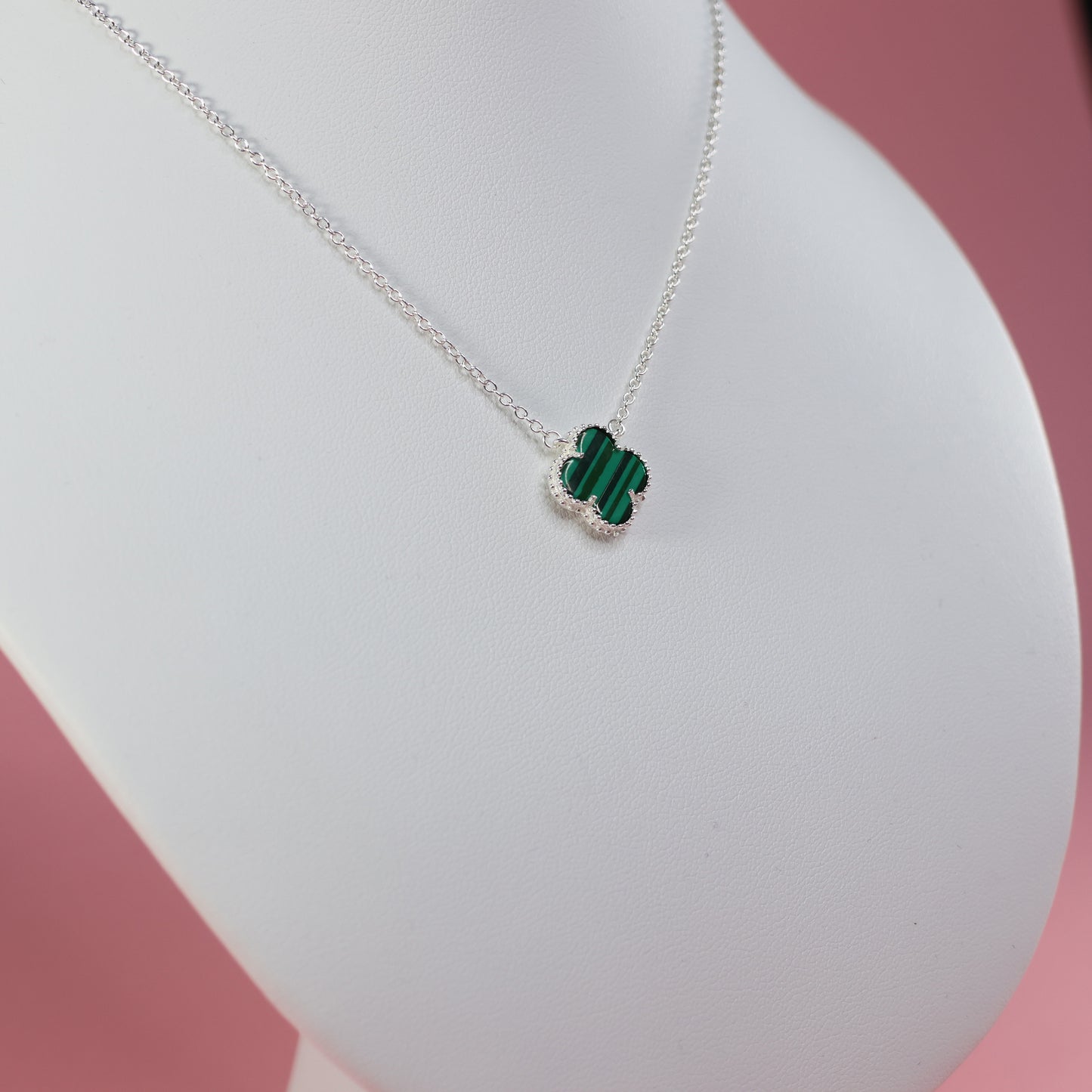 Malachite Clover Necklace featuring a green clover pendant on a delicate silver chain