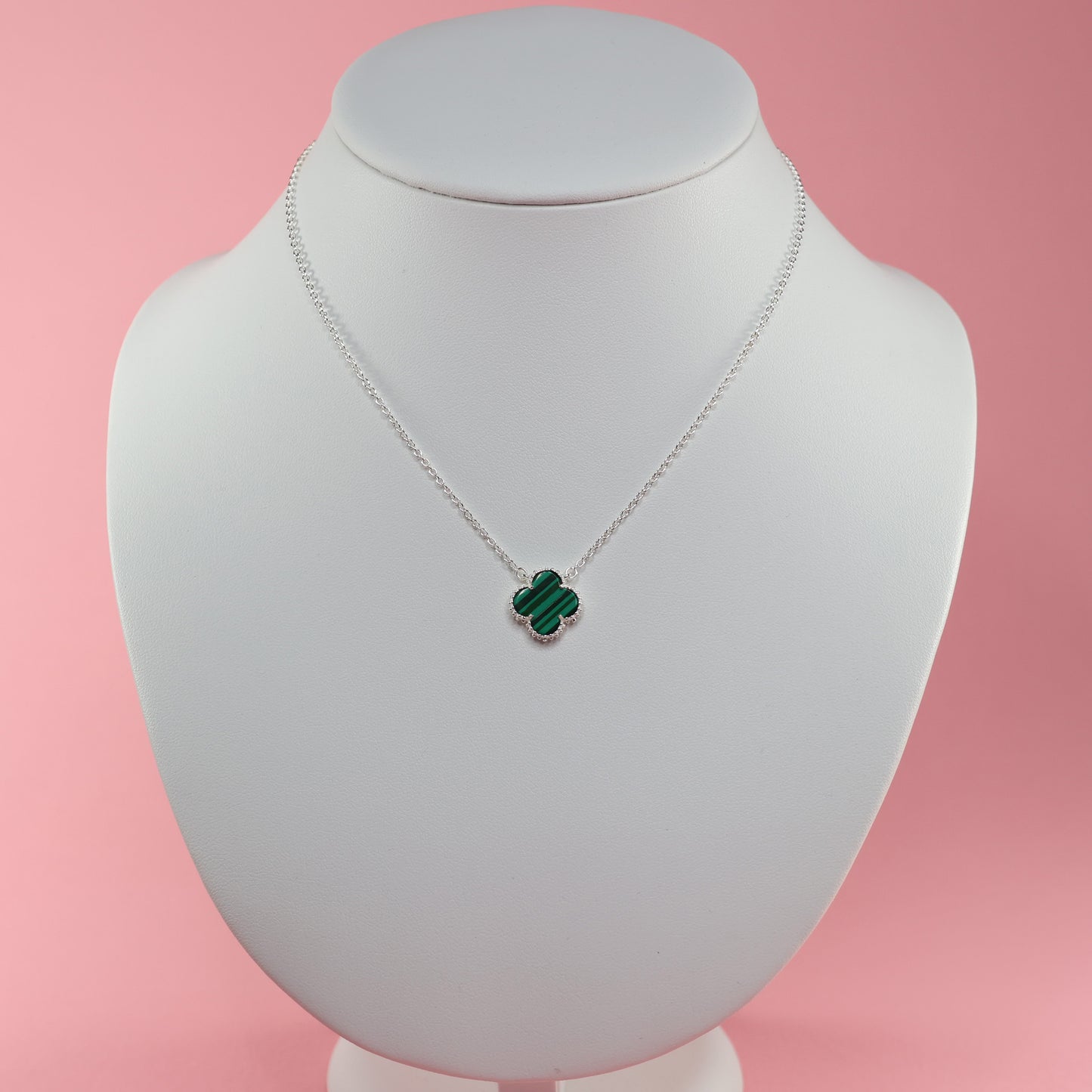 Malachite Clover Necklace on a silver chain, featuring a vibrant green clover pendant.