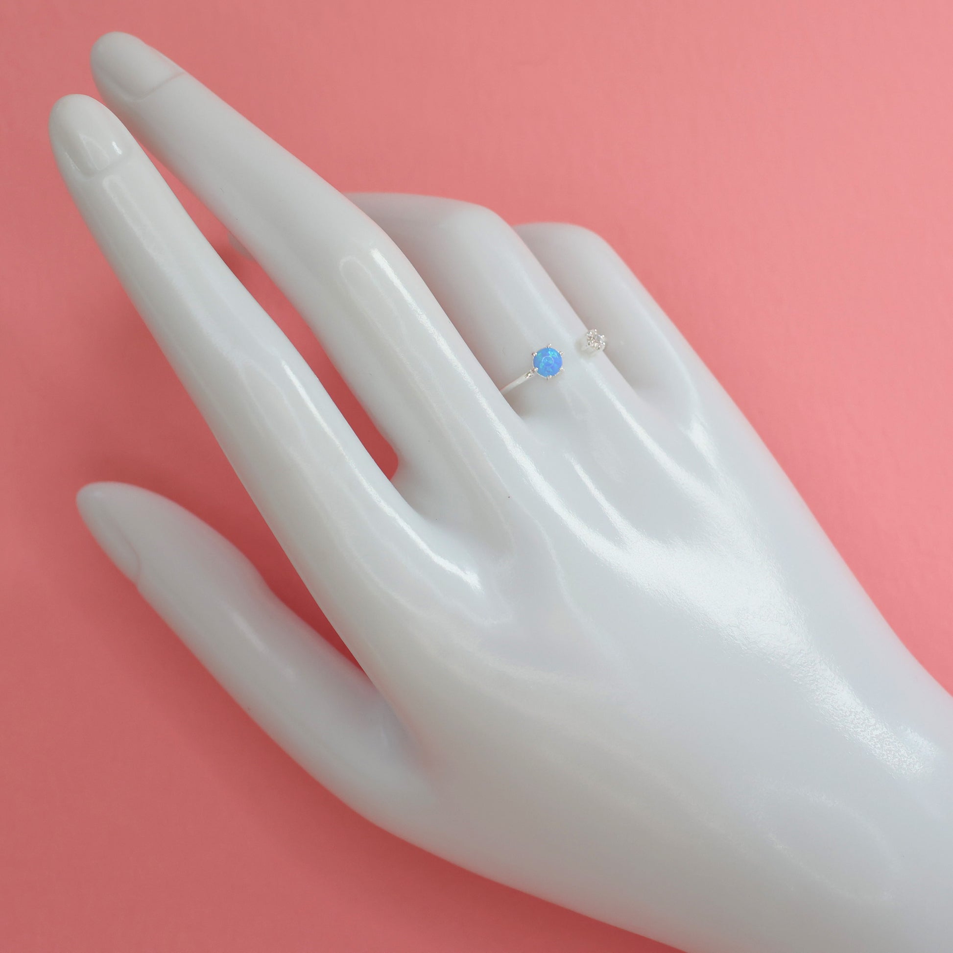 Stylish Opalite silver ring featured on a hand model with a delicate design