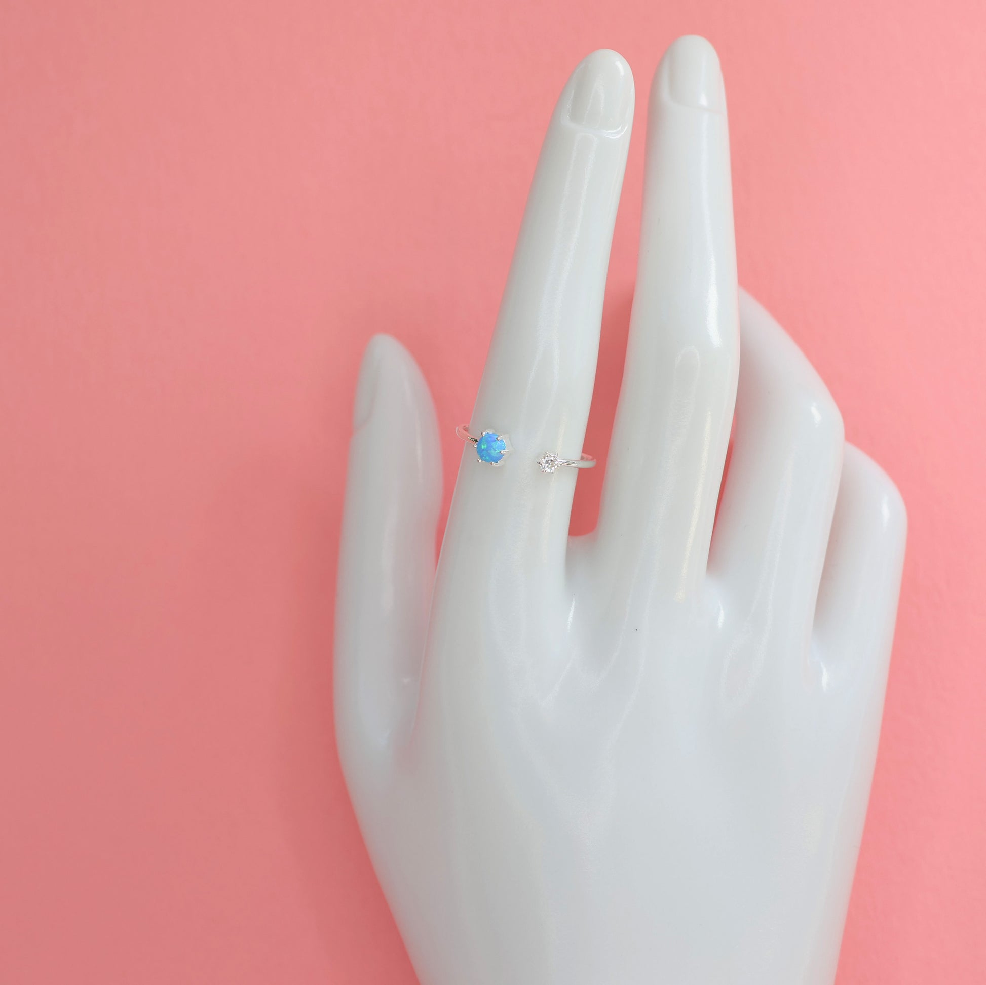 Elegant Opalite silver ring featuring a delicate design displayed on a mannequin hand