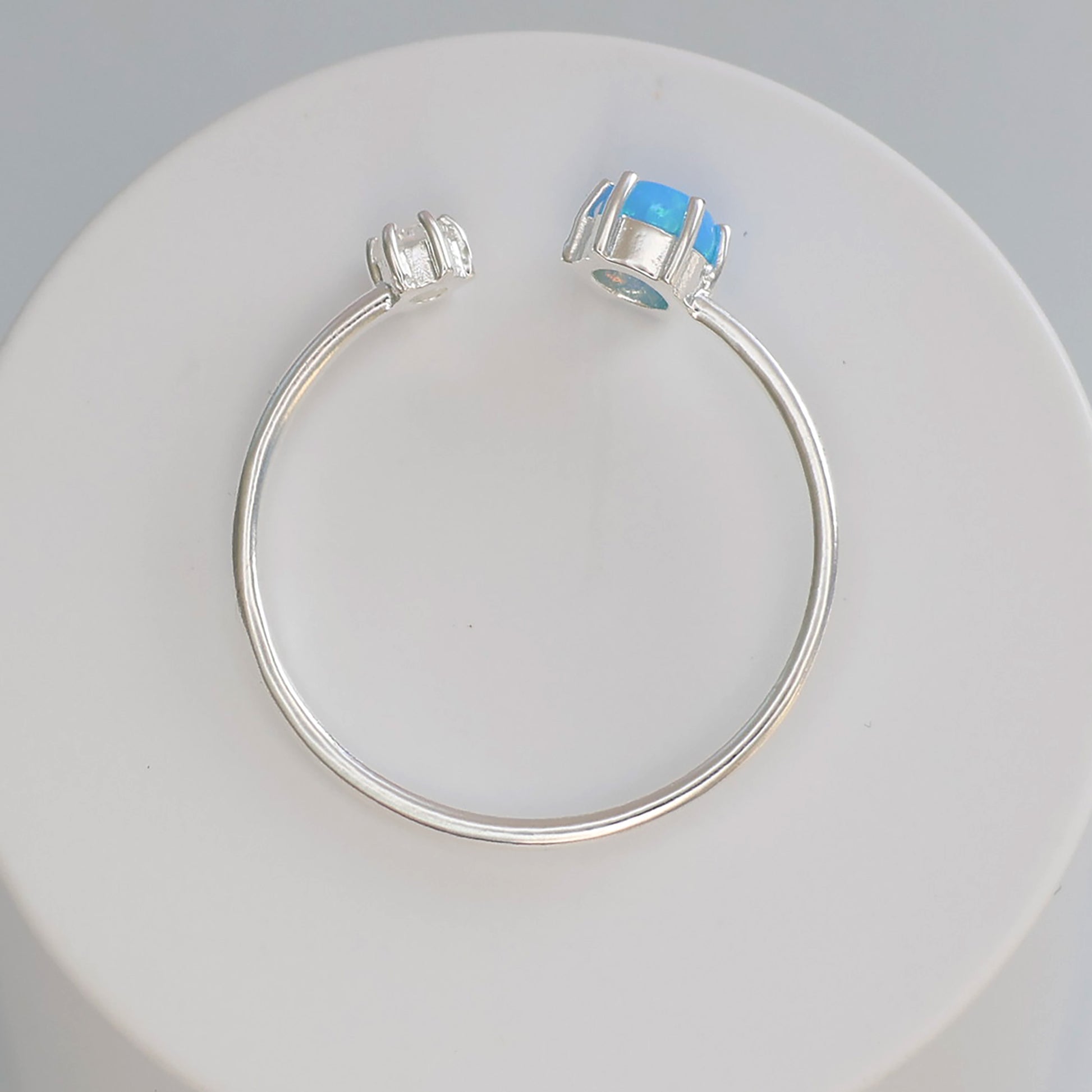 Elegant Opalite silver ring with a smooth, round stone set in a simple band