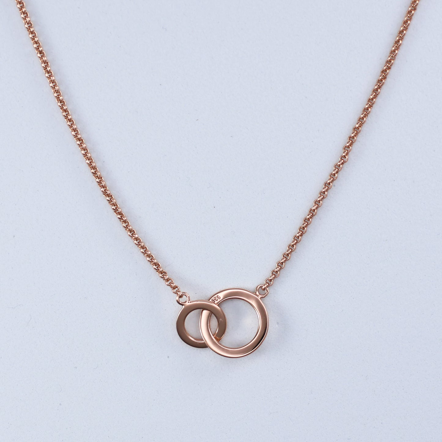 Elegant rose gold double hoop pendant on a fine chain for a stylish accessory