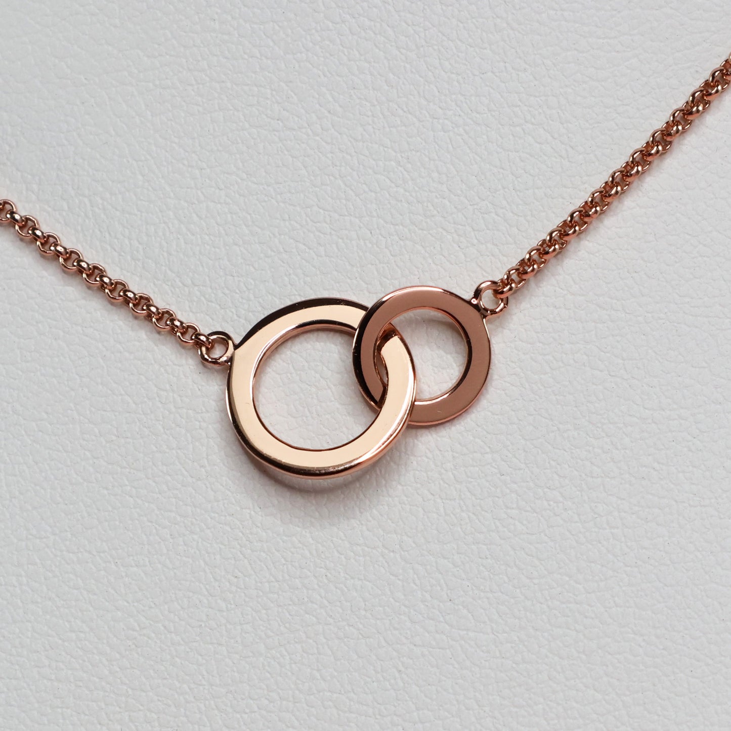 Rose gold double hoop pendant on a delicate chain, perfect for everyday elegance