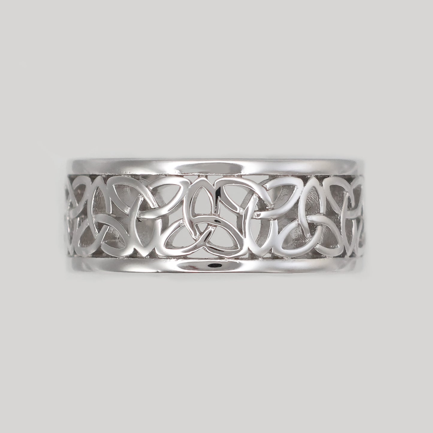 Elegant Silver Celtic band ring with intricate knotwork design and polished finish