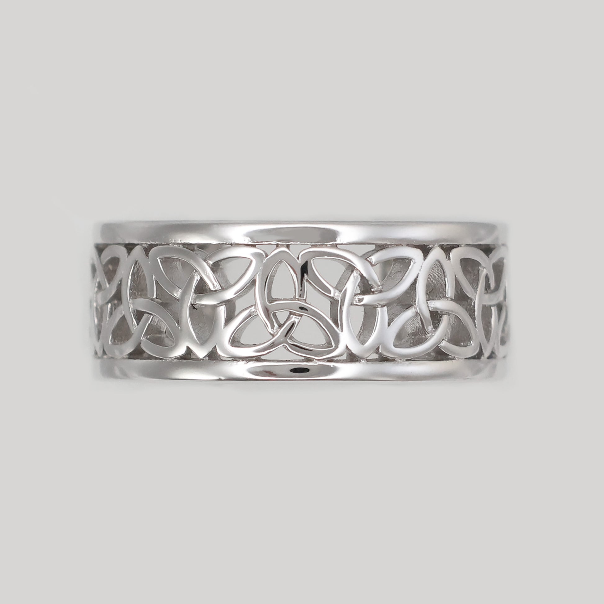 Elegant Silver Celtic band ring with intricate knotwork design and polished finish