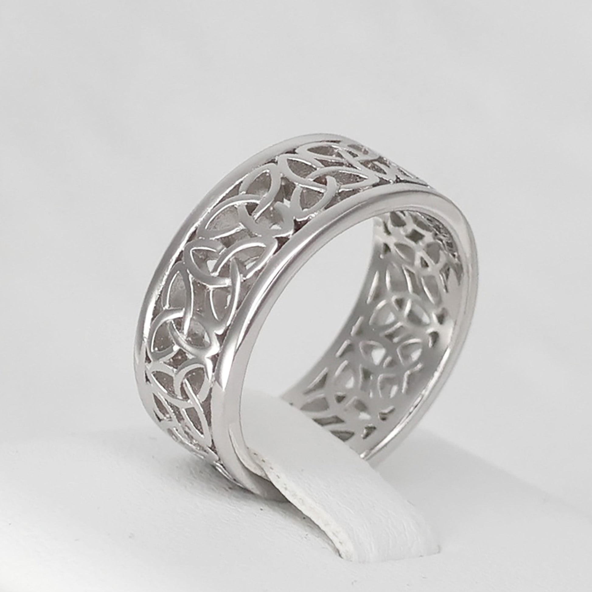 Stylish Silver Celtic band ring with intricate cut-out patterns for elegant jewelry lovers
