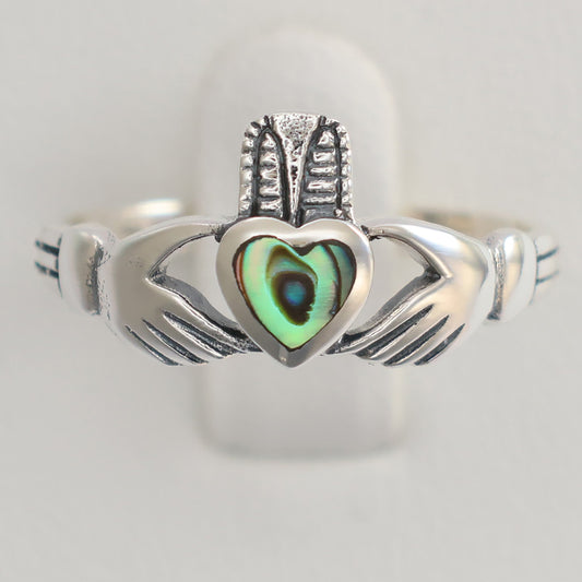 Beautiful silver claddagh ring featuring a colorful heart design and detailed hands