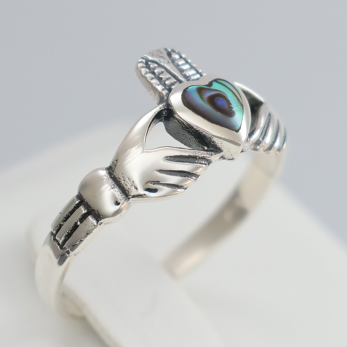 Elegant silver claddagh ring featuring a heart and intricate hand design, perfect for expressing love and friendship