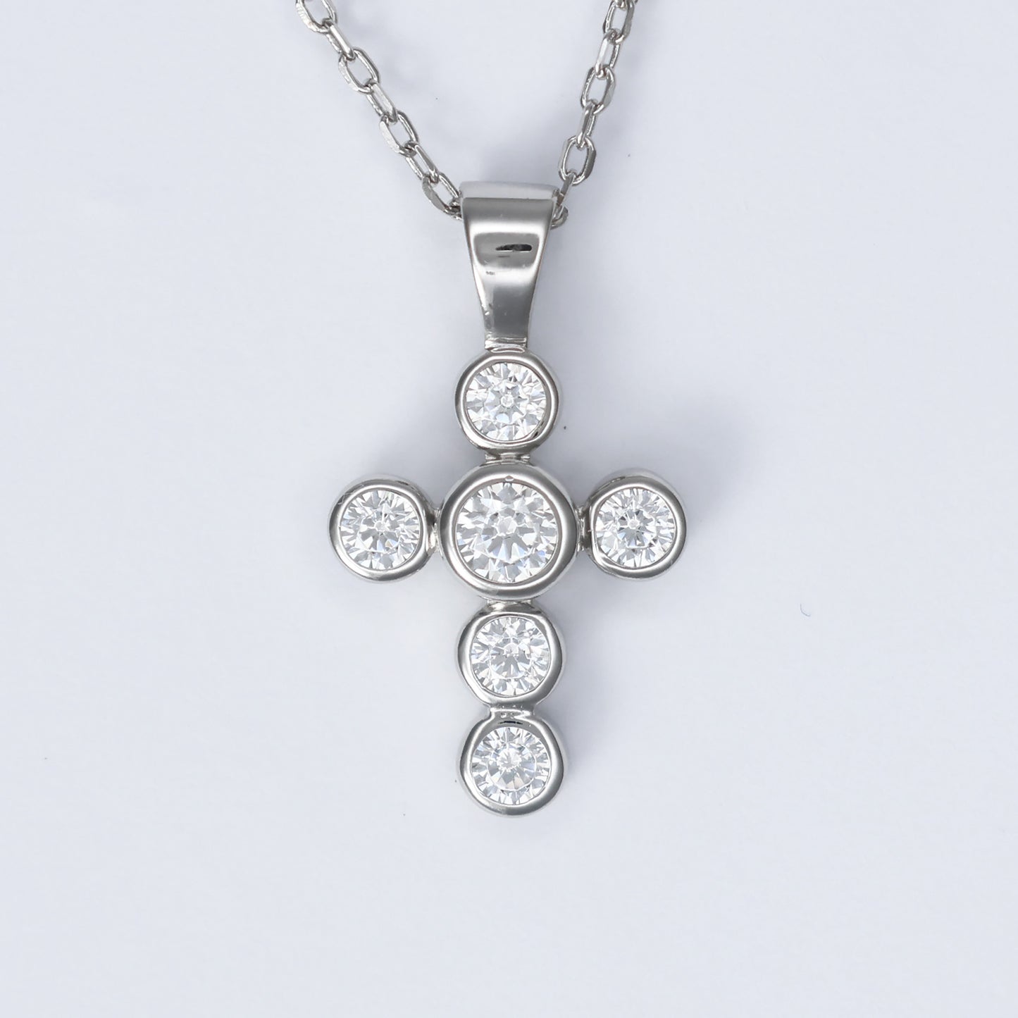 Elegant silver cross necklace for women embellished with sparkling clear stones