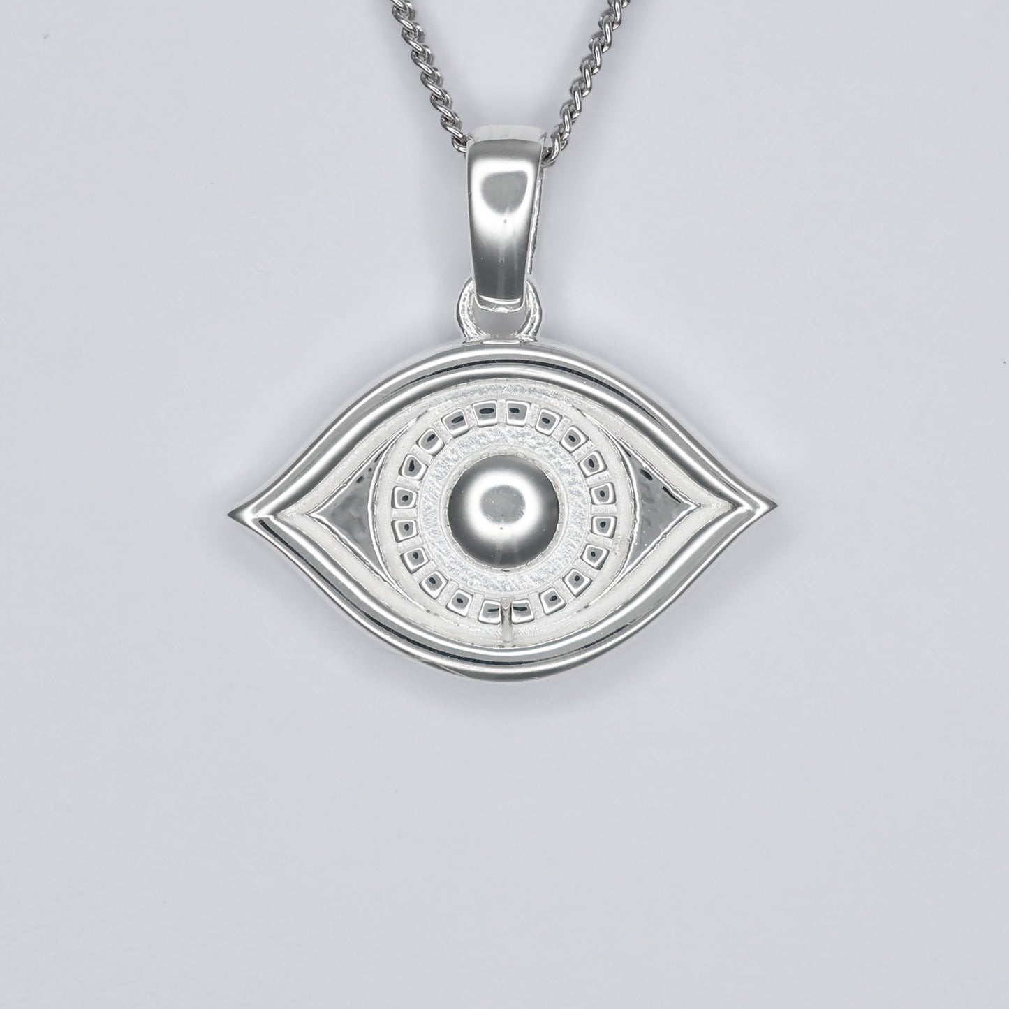 Elegant silver eye pendant necklace featuring intricate detailing and a polished finish