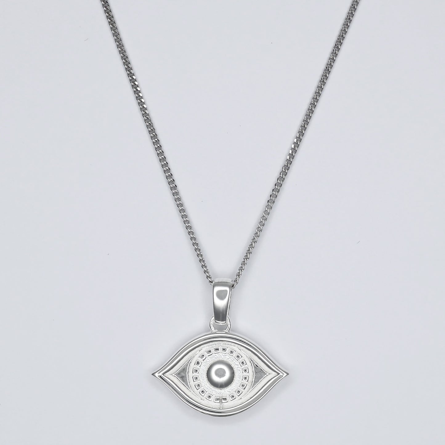 Silver eye pendant necklace featuring a detailed eye design on a delicate chain