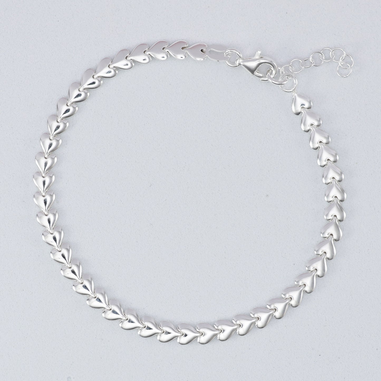 Elegant silver heart link bracelet featuring a stylish design for everyday wear