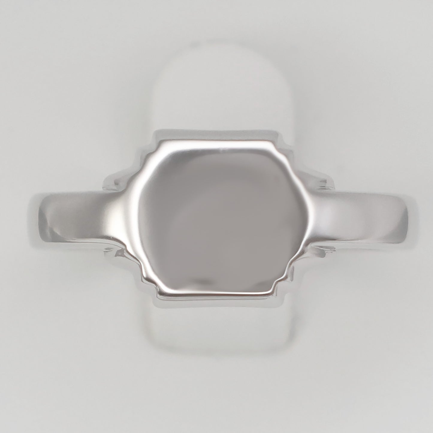 Elegant silver hexagon signet ring with a polished finish for a timeless look