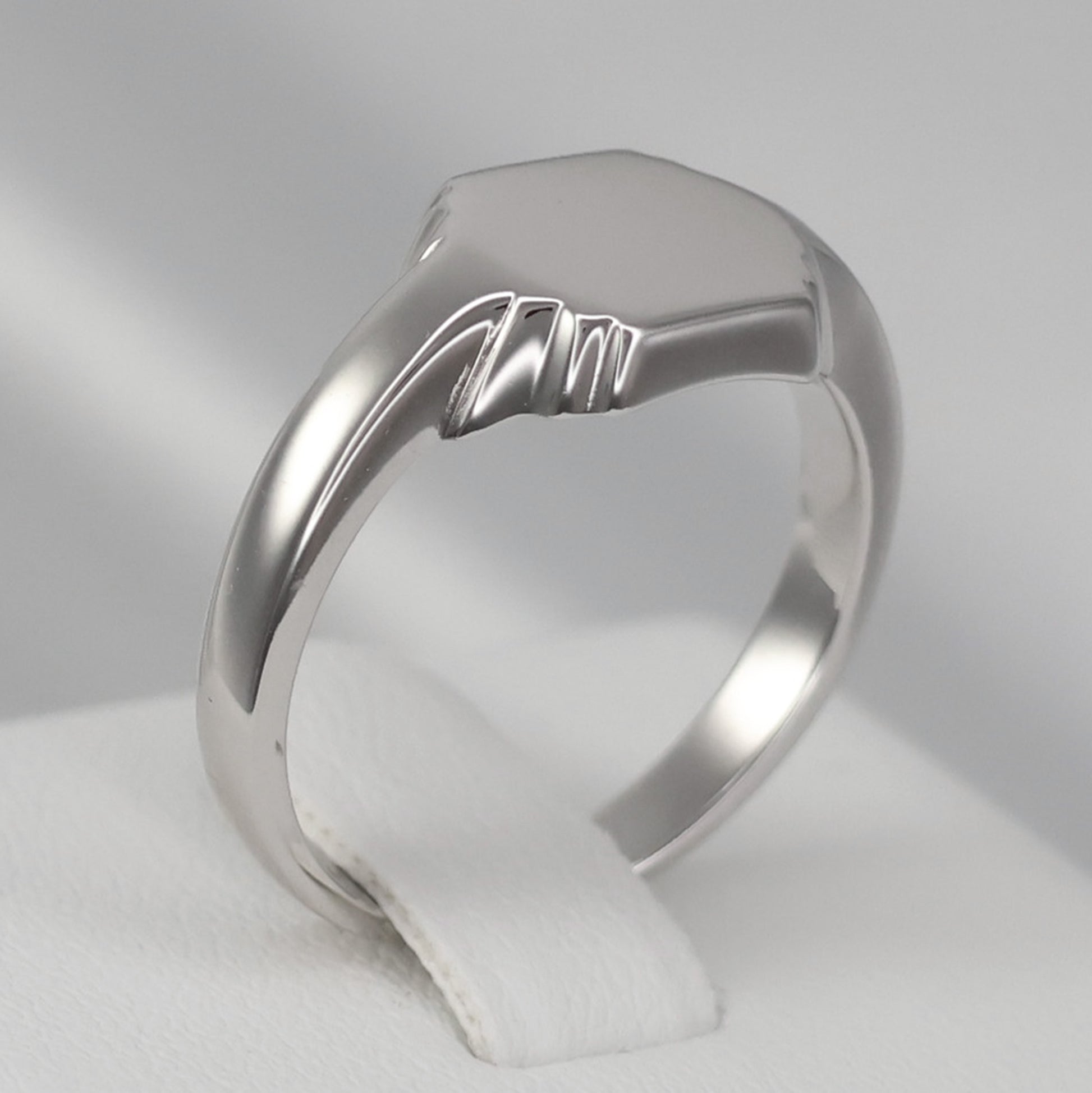 Sleek silver hexagon signet ring with a polished finish for a modern look