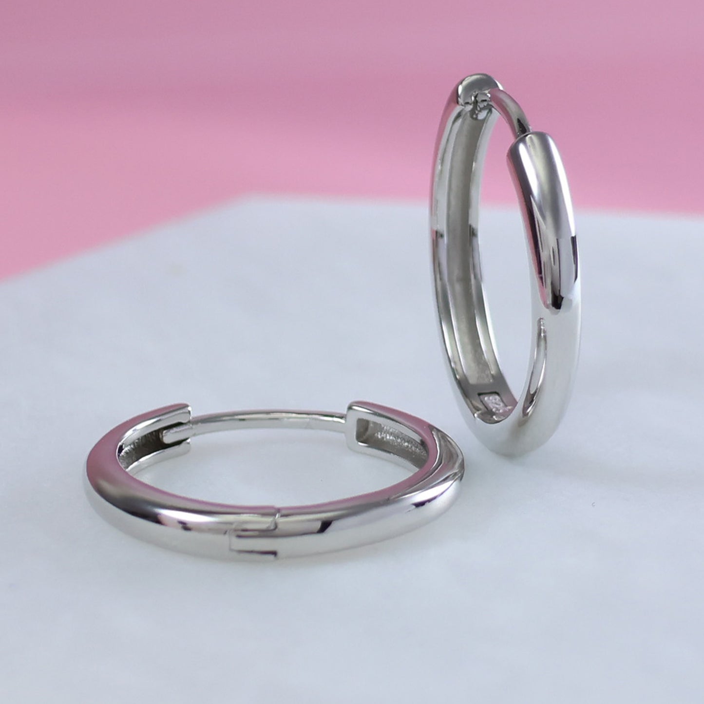 Polished silver hoop earrings 20mm with a sleek and modern design, perfect for everyday wear