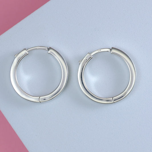 Stylish silver hoop earrings 25mm with a polished finish for everyday wear