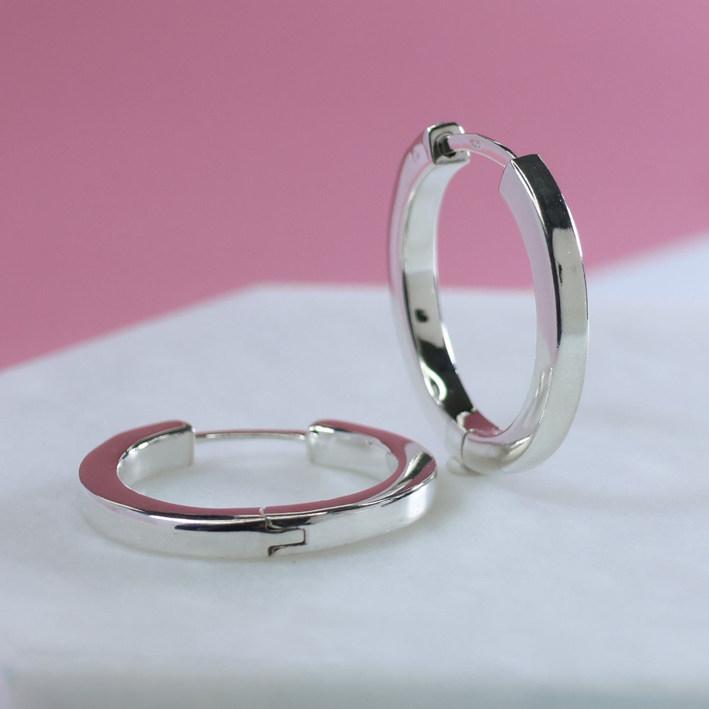 Stylish silver hoop earrings 25mm with a modern design perfect for everyday wear