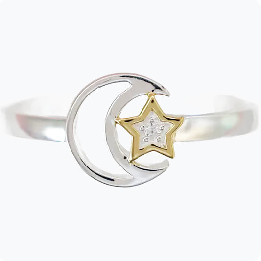 Silver moon and star ring with gold accents and sparkling details for a celestial look