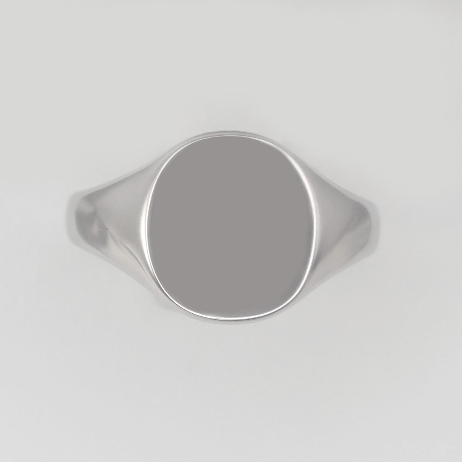 Silver signet ring size R with a smooth, polished surface and a sleek design