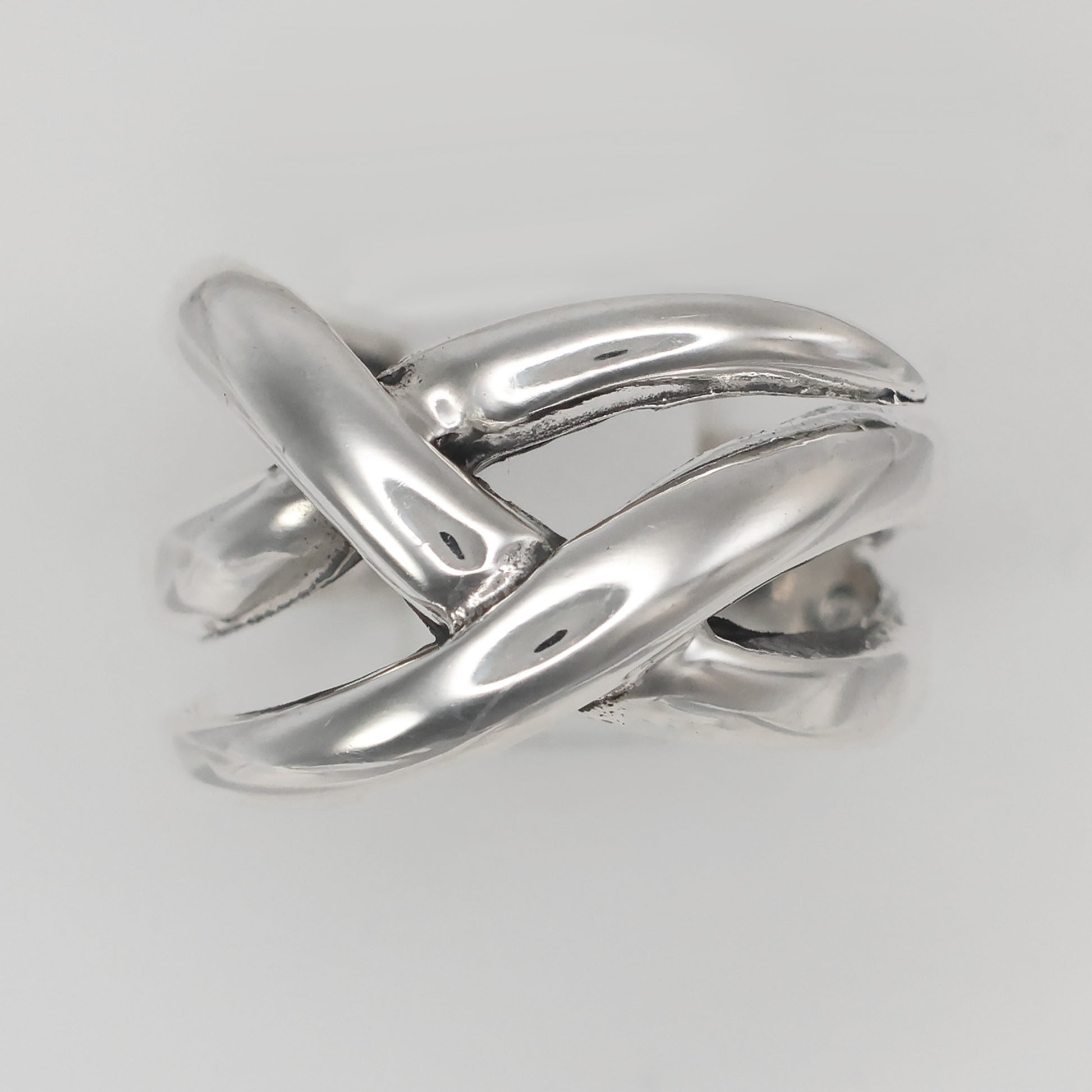 Stylish Weave design ring size Q in polished silver with an intricate braided pattern