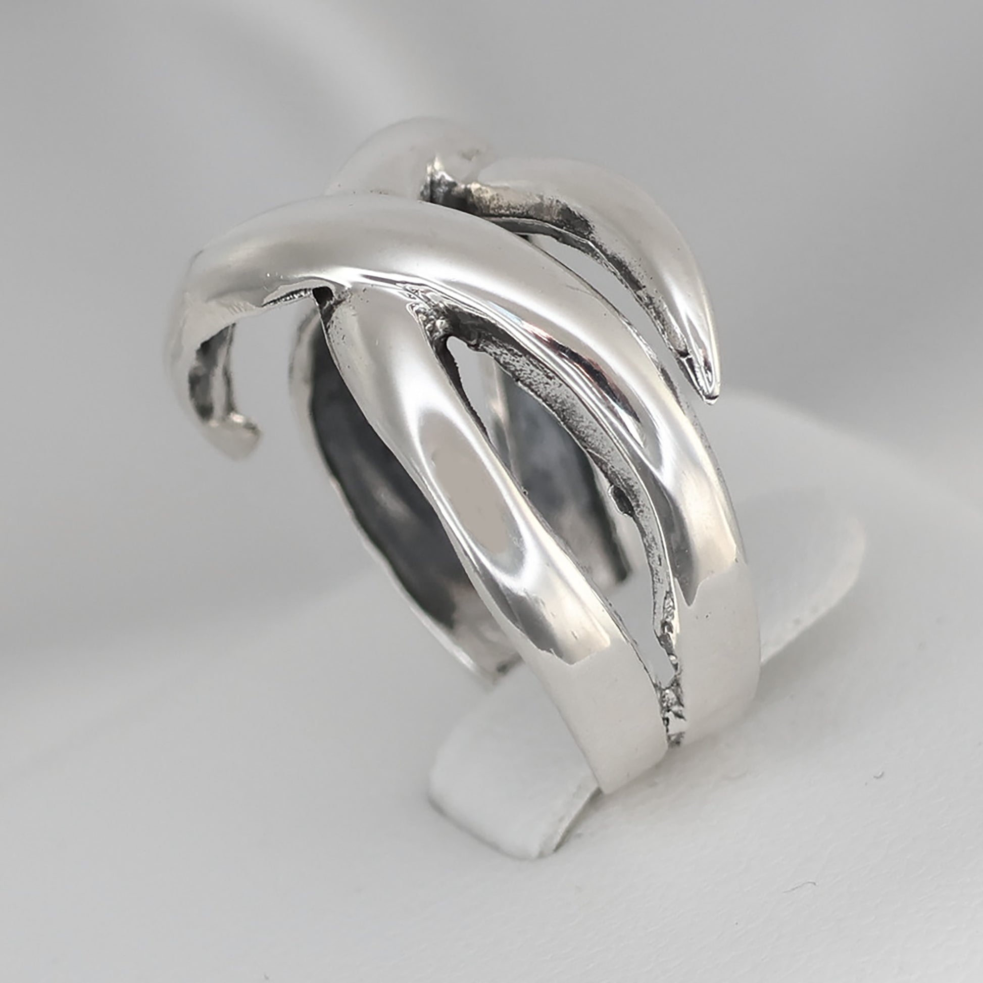 Stylish Weave design ring size Q in polished silver, featuring a unique twisted pattern