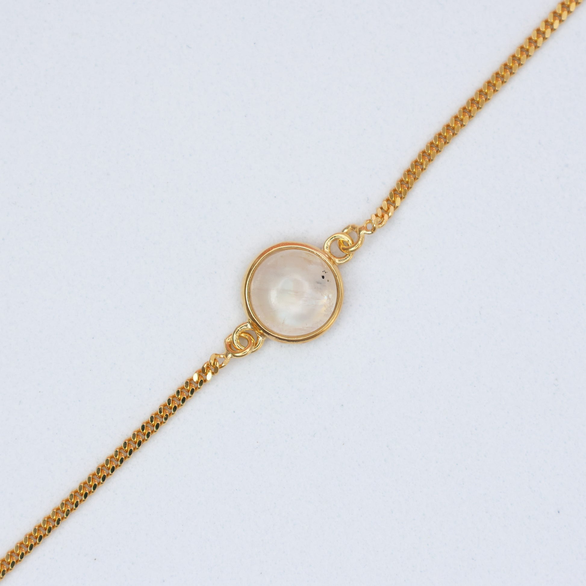 Elegant Gold Moonstone Bracelet featuring a polished moonstone centerpiece on a gold chain