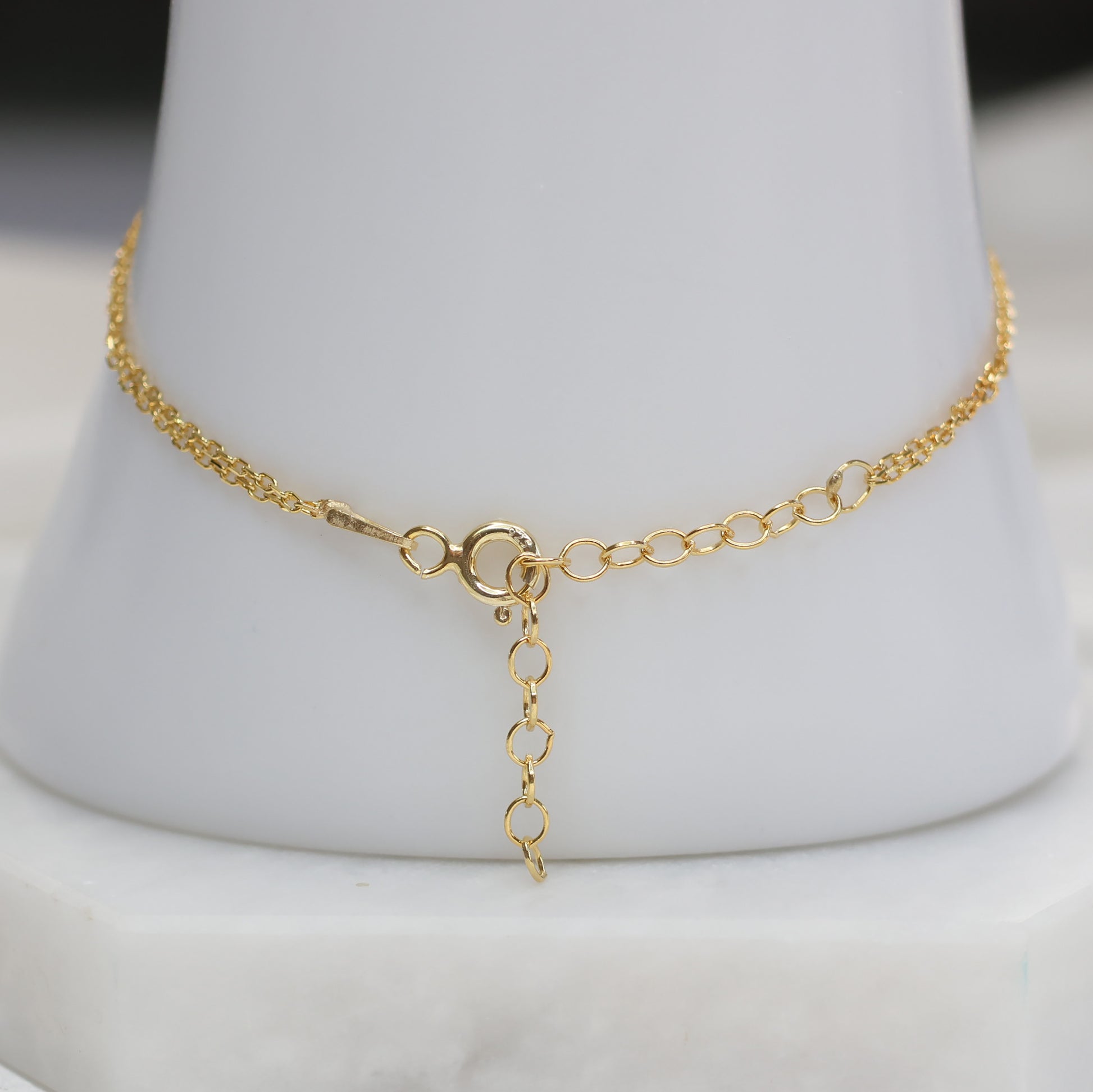 Delicate gold plated evil eye bracelet with lobster clasp and adjustable chain for a stylish look