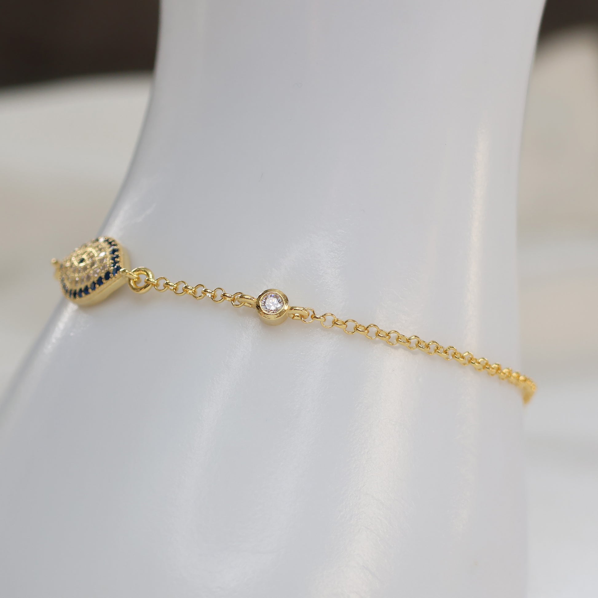 Elegant gold plated evil eye bracelet with sparkling accent for stylish protection