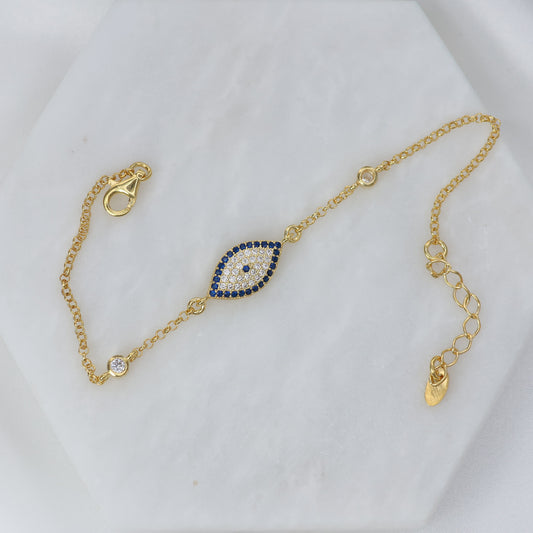 Gold plated evil eye bracelet with blue and white gemstones for stylish protection