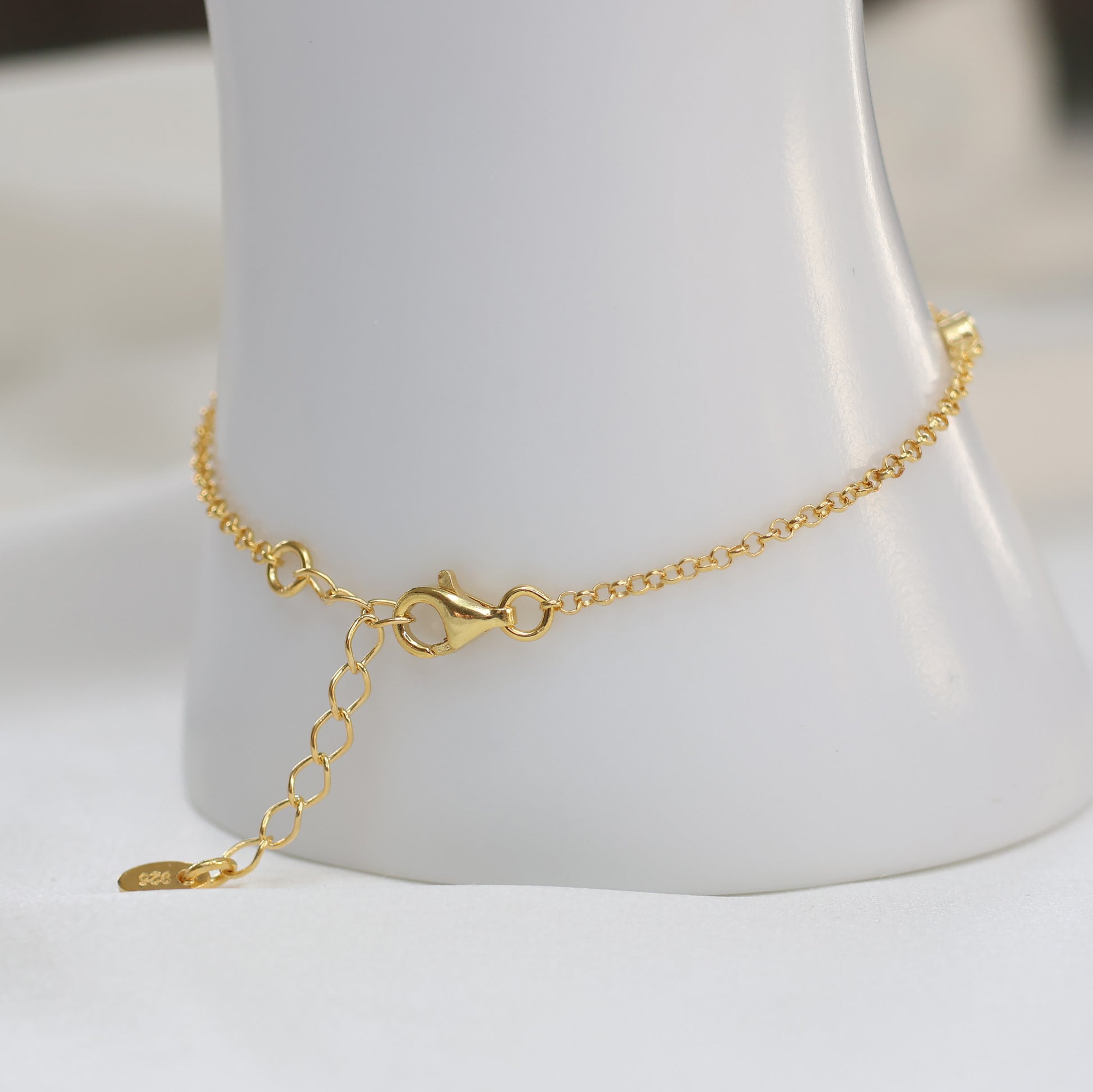 Gold plated evil eye bracelet with adjustable chain for a stylish look and protection