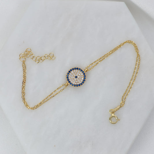 Gold plated evil eye bracelet with sparkling gemstones on a delicate chain