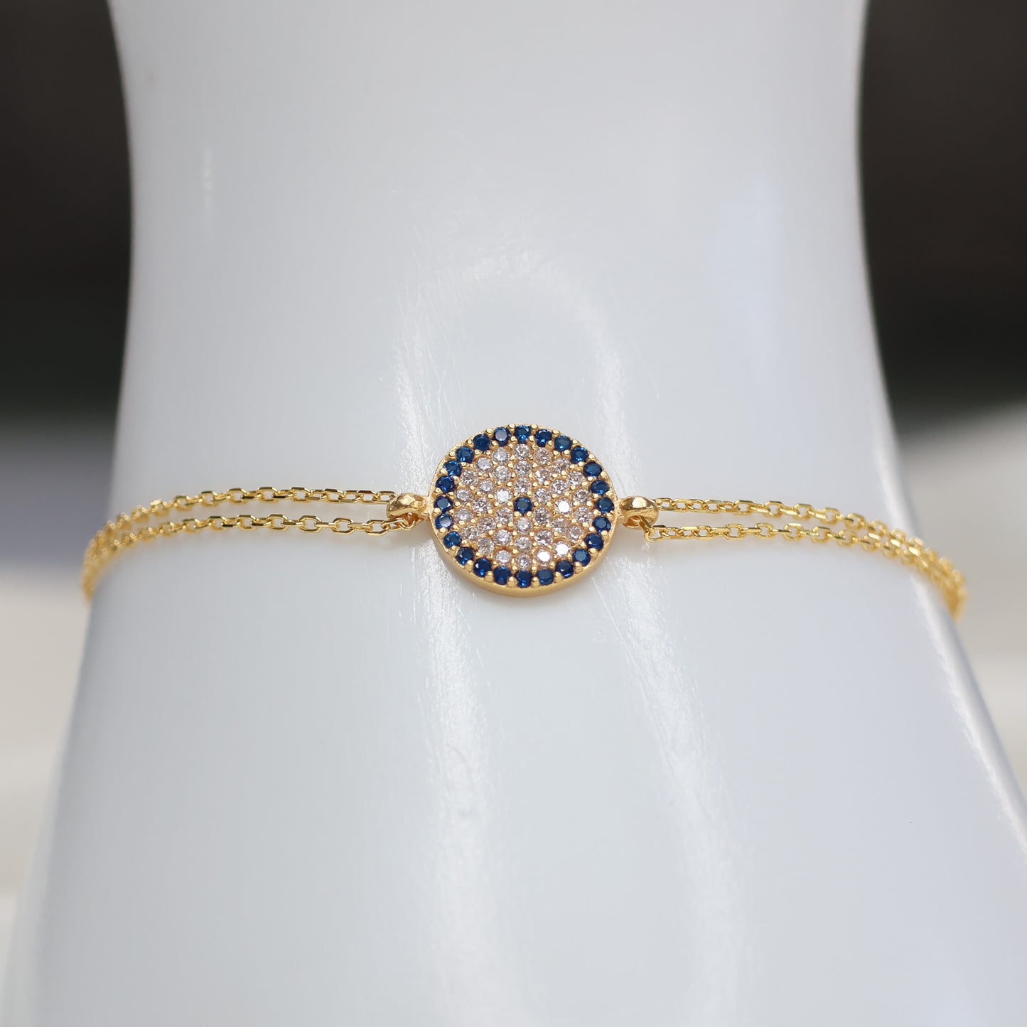 Gold plated evil eye bracelet with a sparkling design on a delicate chain