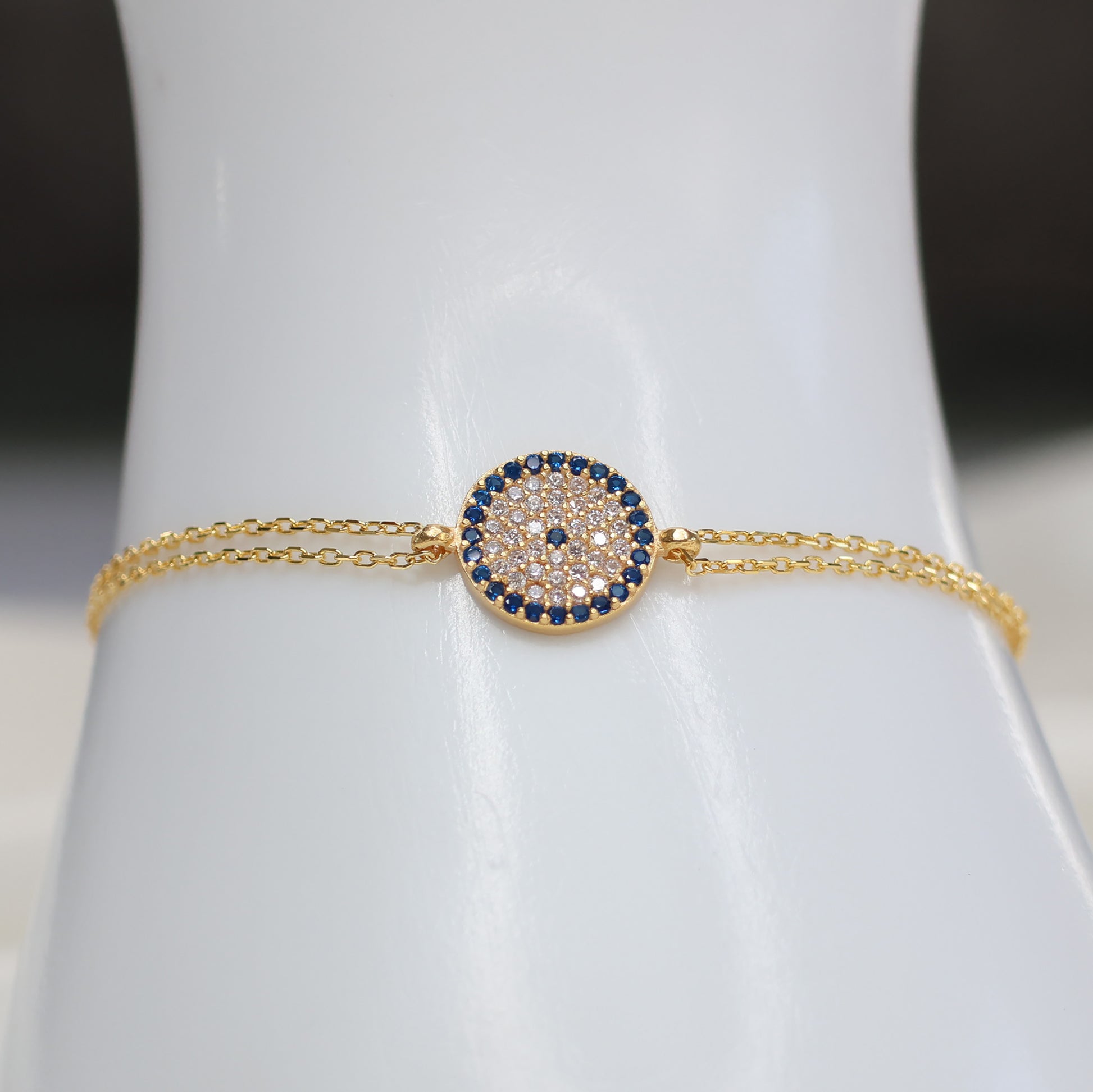 Gold plated evil eye bracelet with a sparkling design on a delicate chain