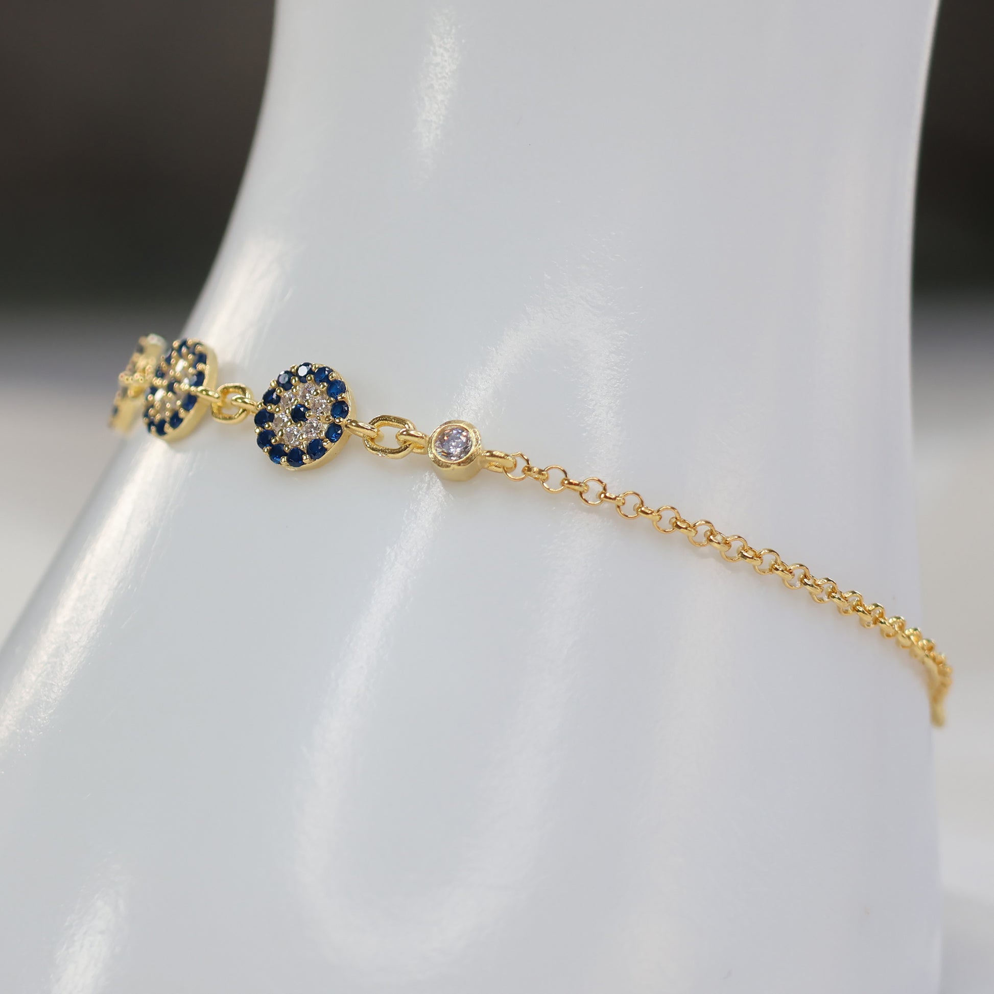 Delicate gold plated evil eye bracelet with navy blue stones and sparkling accent diamonds