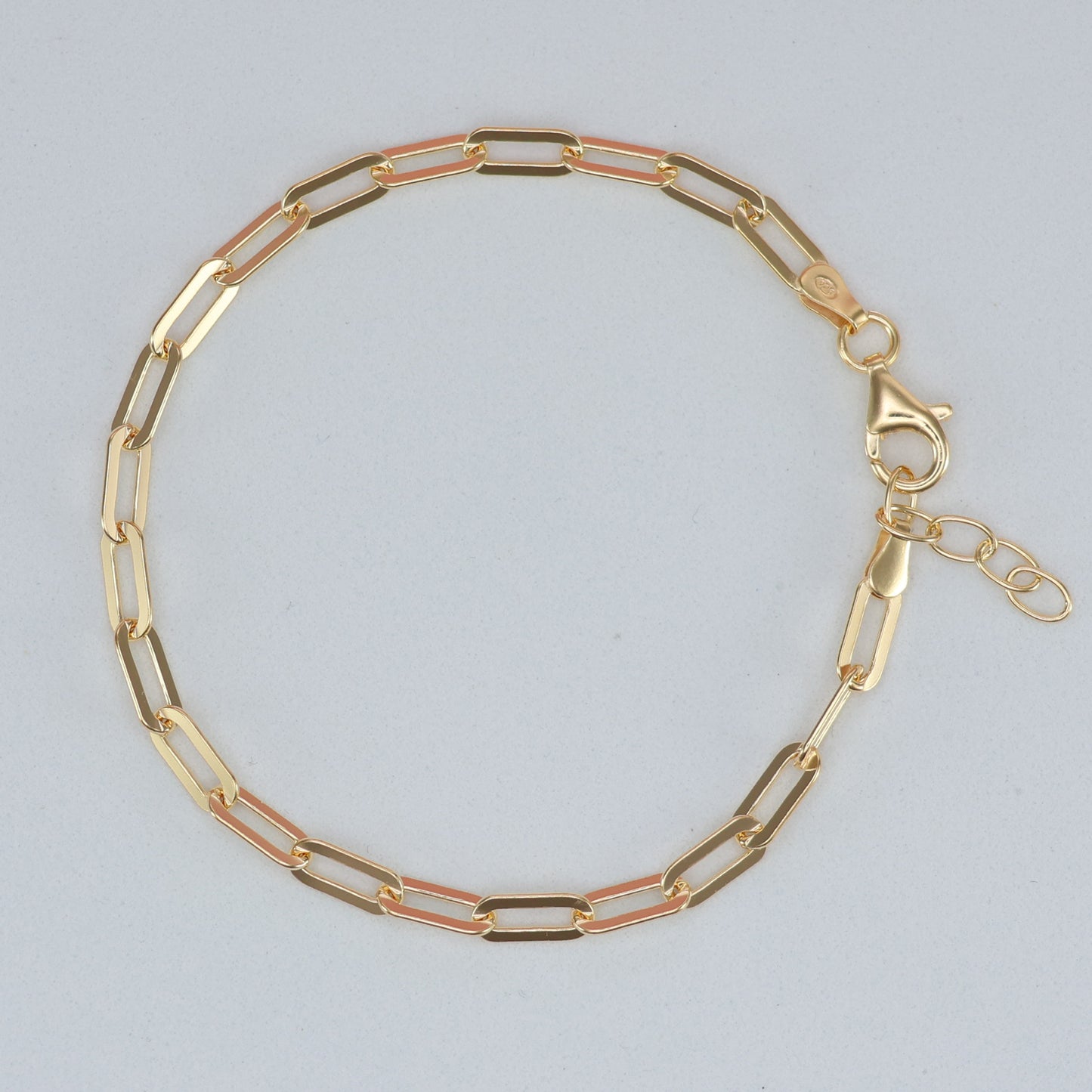 Gold plated paperclip bracelet with alternating gold and rose gold links for stylish accessories
