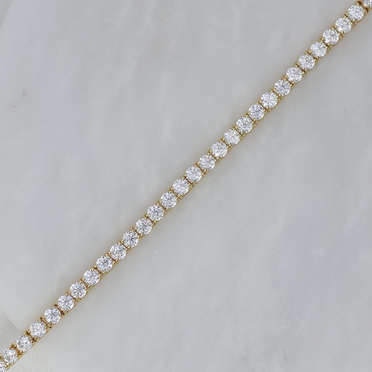 Elegant gold plated tennis bracelet featuring sparkling cubic zirconia stones for a timeless look