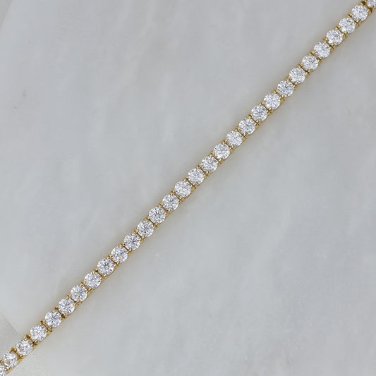 Elegant gold plated tennis bracelet featuring sparkling cubic zirconia stones for a timeless look